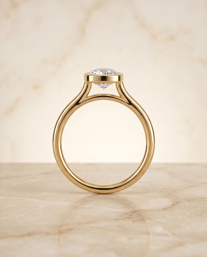 The Duran Bezel Solitaire Engagement Ring Setting for Cushion Diamonds in 18K Yellow Gold
