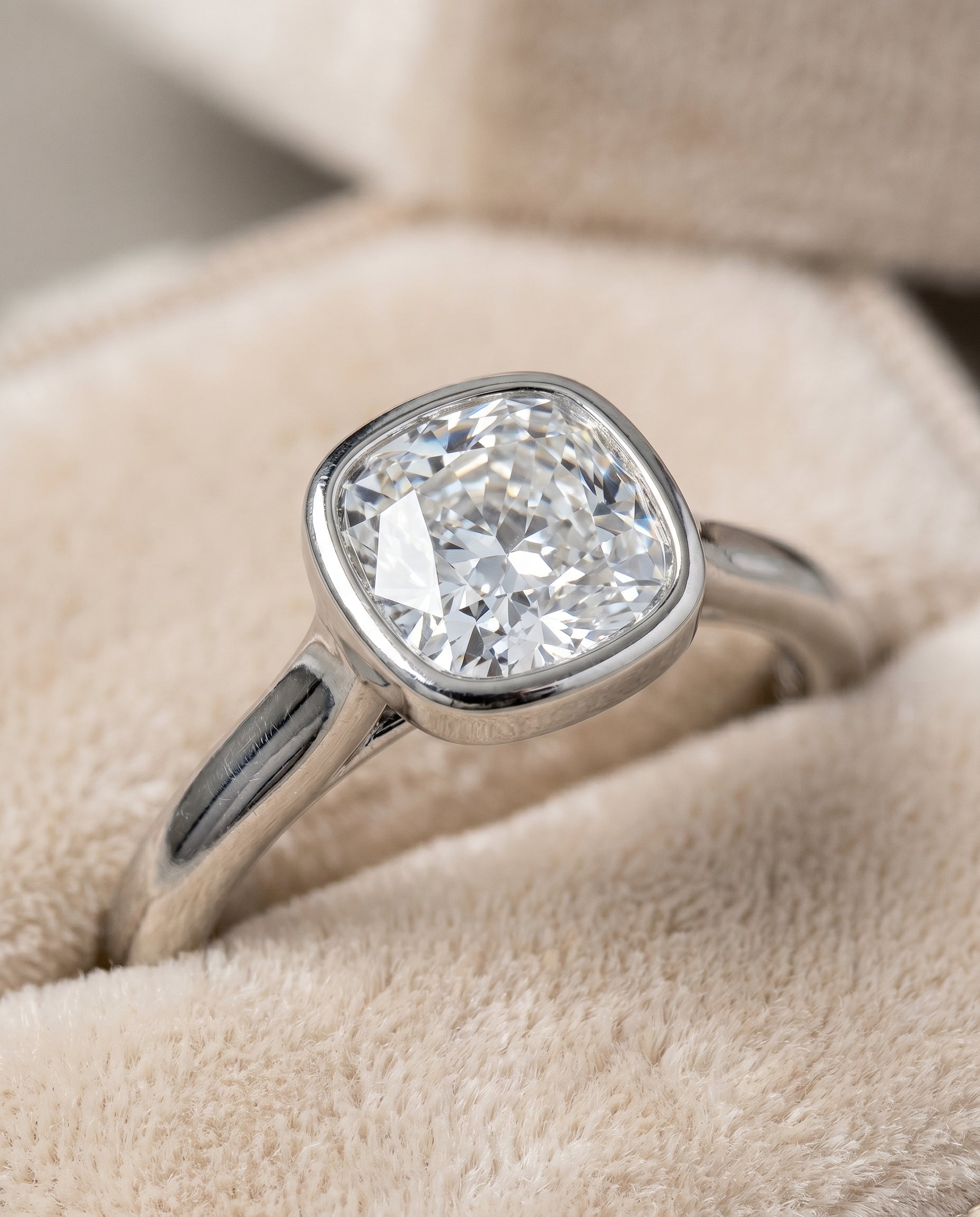 Platinum band of The Duran cushion engagement ring setting | RockHer