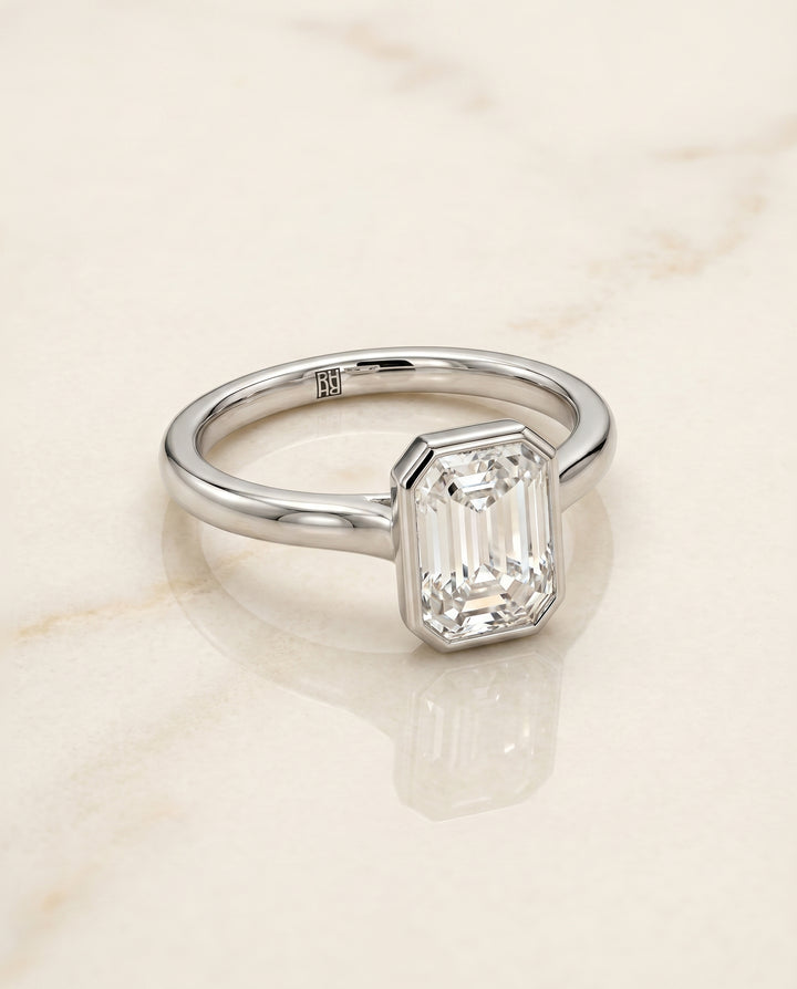 The Duran Bezel Solitaire Engagement Ring Setting for Emerald Cut Diamonds in Platinum | RockHer