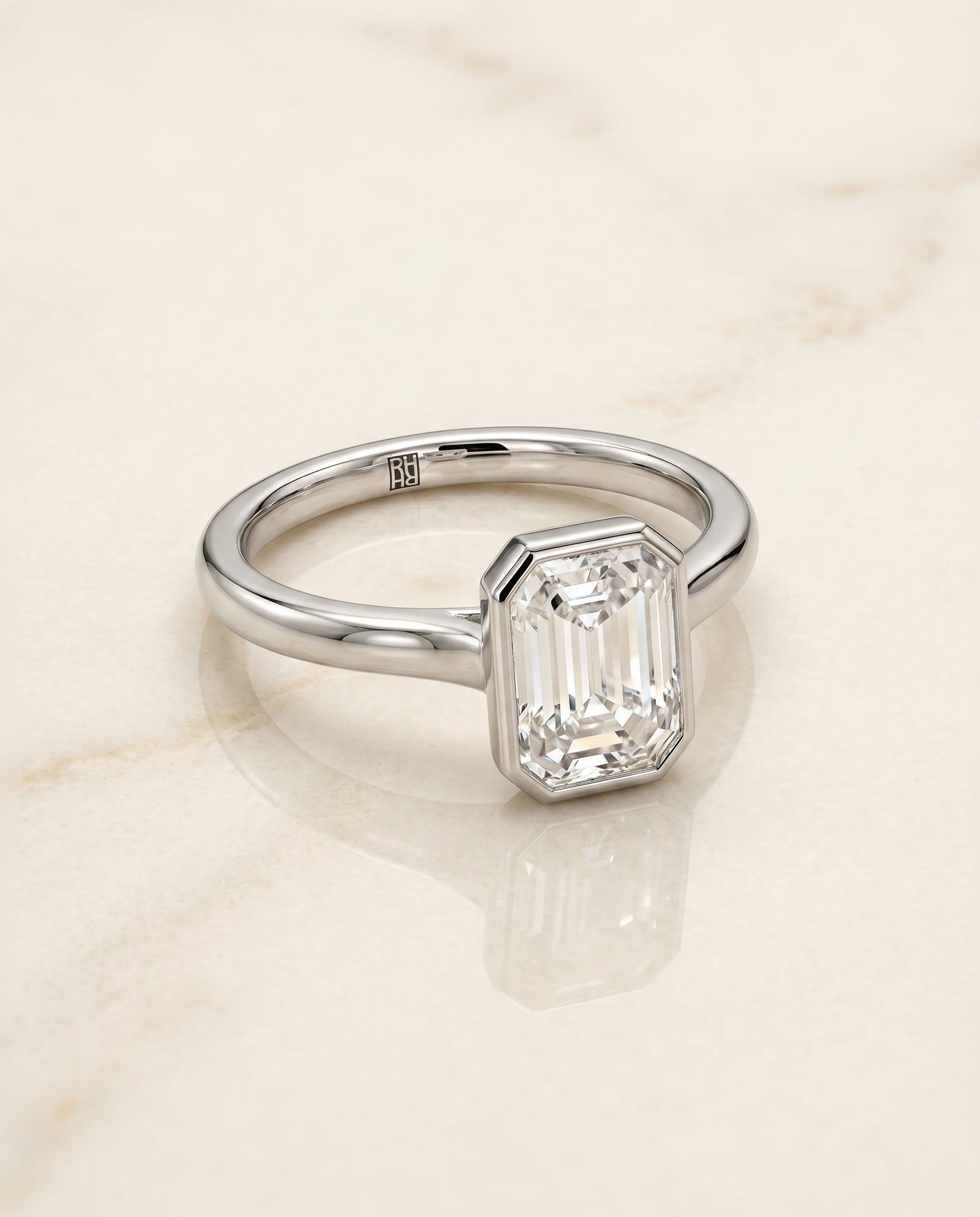 Duran Select Simple Bezel Solitaire Emerald Cut in 18K White Gold – view 1