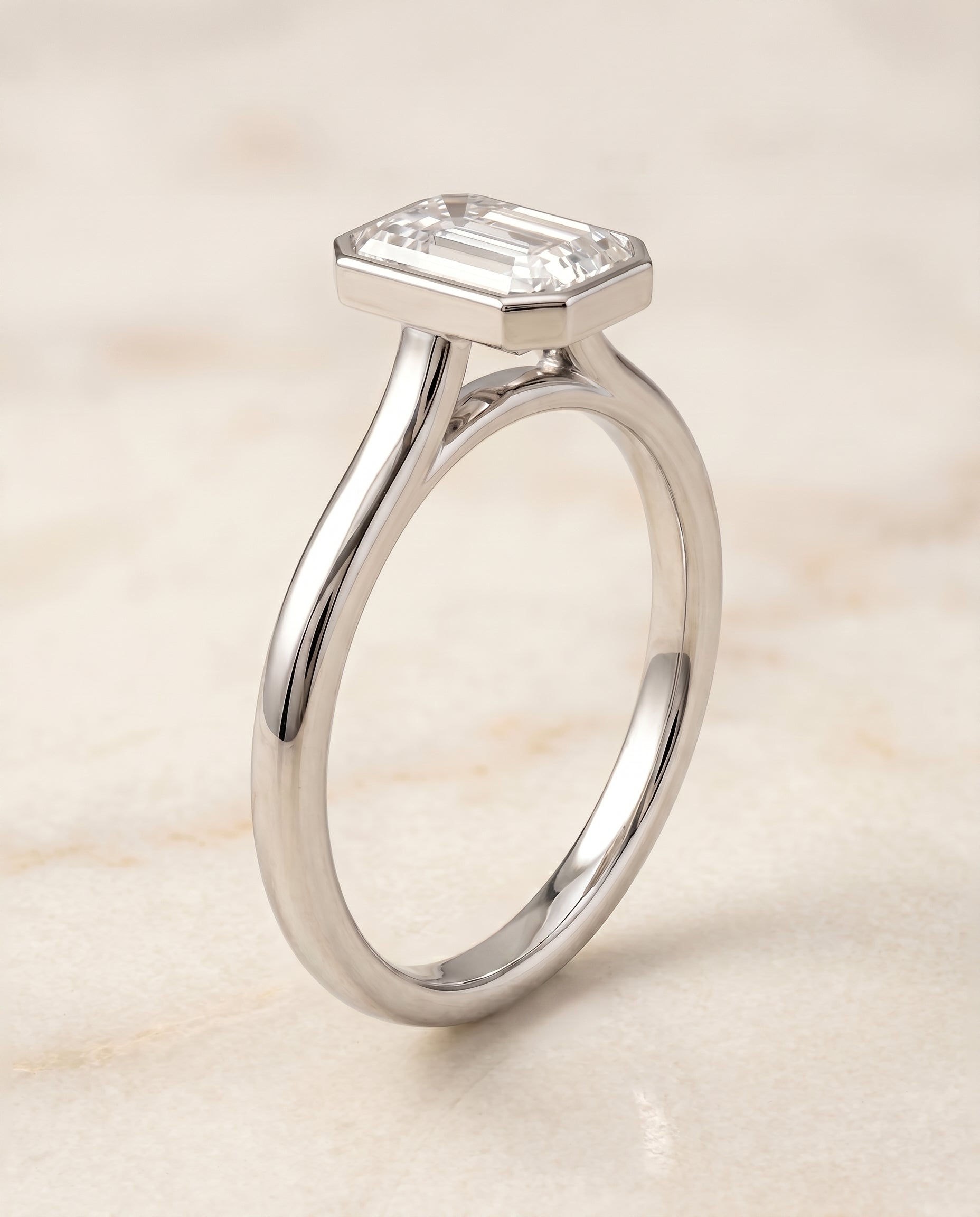 Simple Bezel Solitaire Cut styling on The Duran emerald engagement ring setting | RockHer