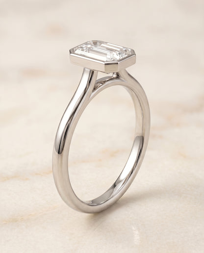 The Duran Simple Bezel Solitaire Emerald Cut Engagement Ring Setting in Platinum