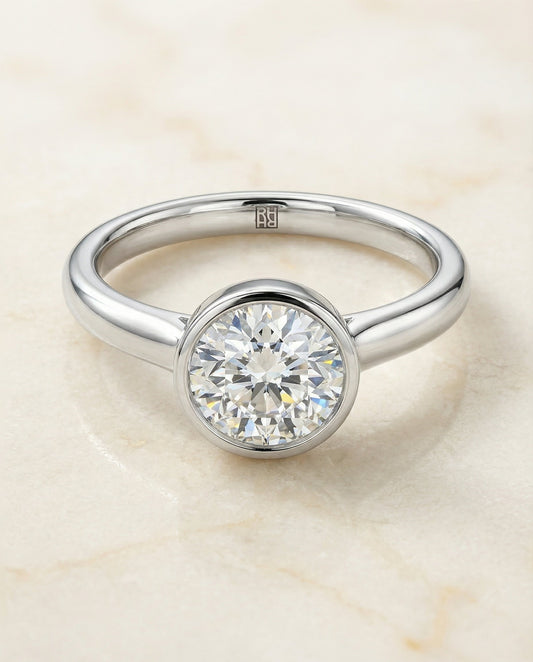 The Duran Select Simple Bezel Solitaire Engagement Ring with Lab Diamond in Platinum — view 1