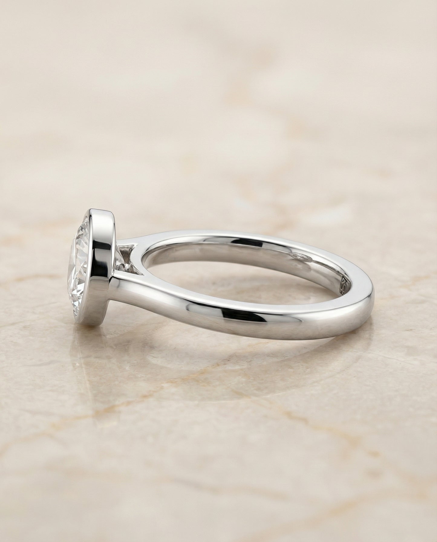 The Duran Simple Bezel Solitaire in 18K White Gold