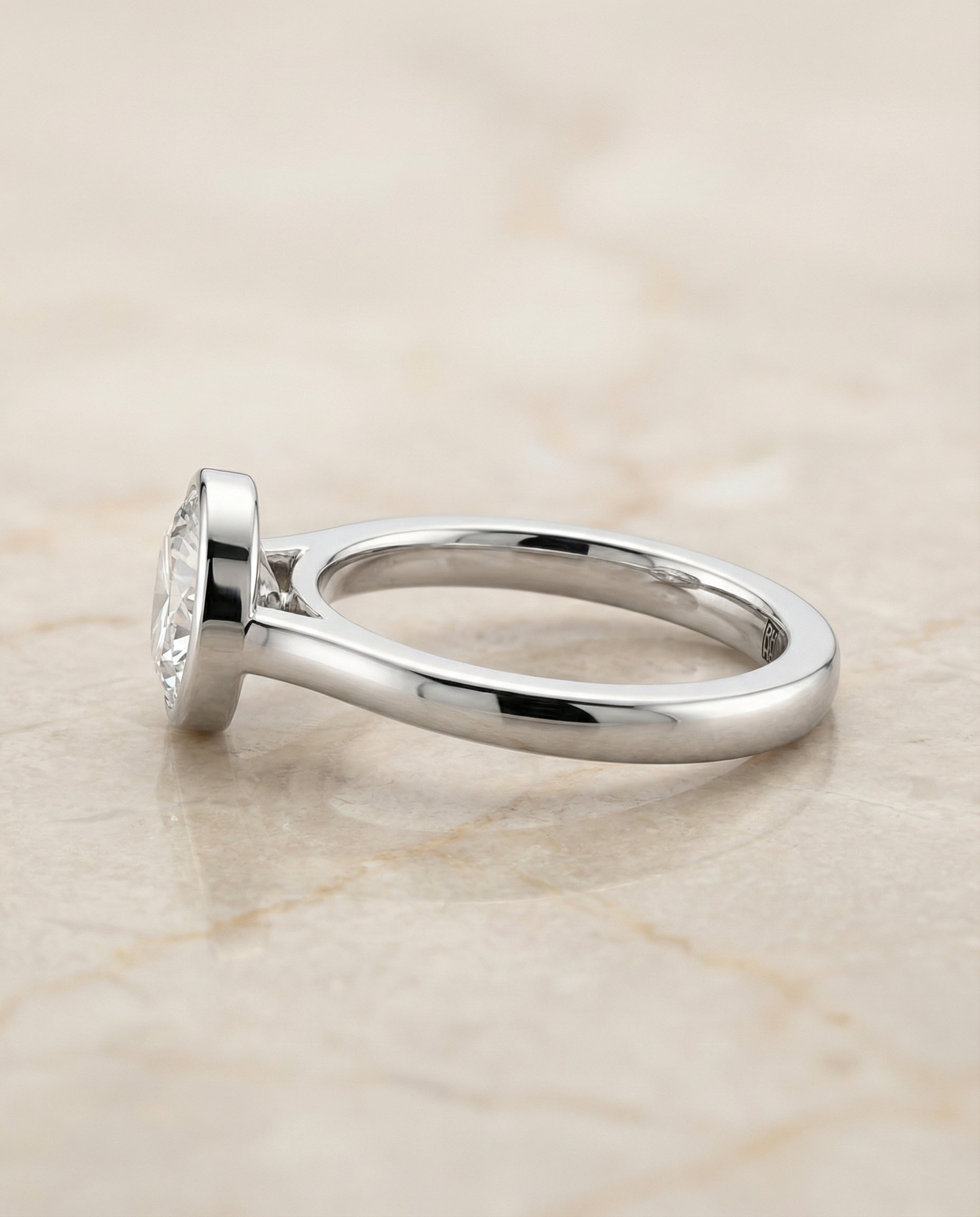 Duran Select Simple Bezel Solitaire Round Lab Diamond Engagement Ring in 18K White Gold, side view | RockHer