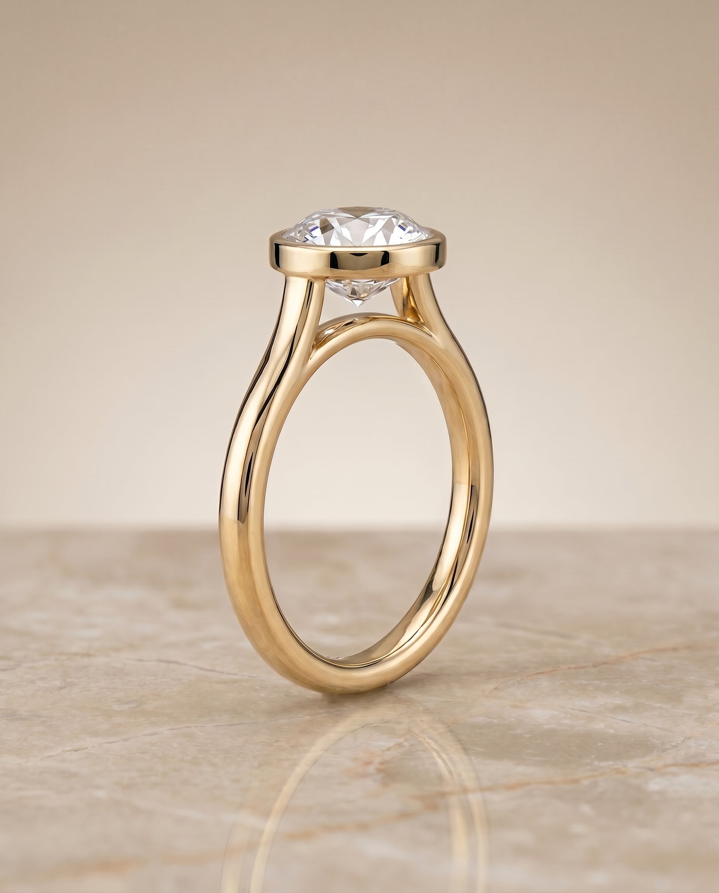 The Duran Bezel Solitaire Engagement Ring Setting for Round Diamonds in 18K Yellow Gold