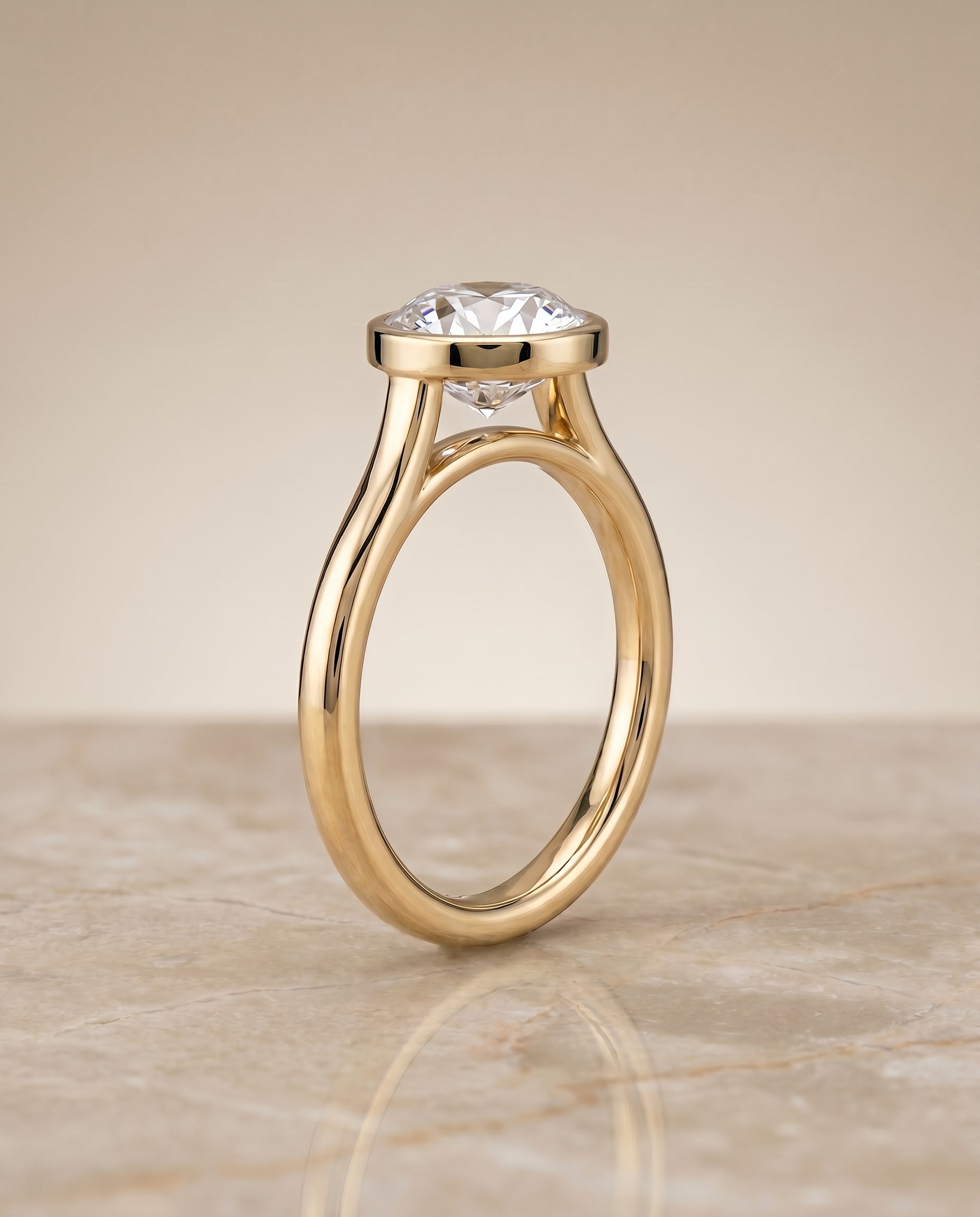 Simple Bezel Solitaire styling on The Duran round engagement ring setting | RockHer