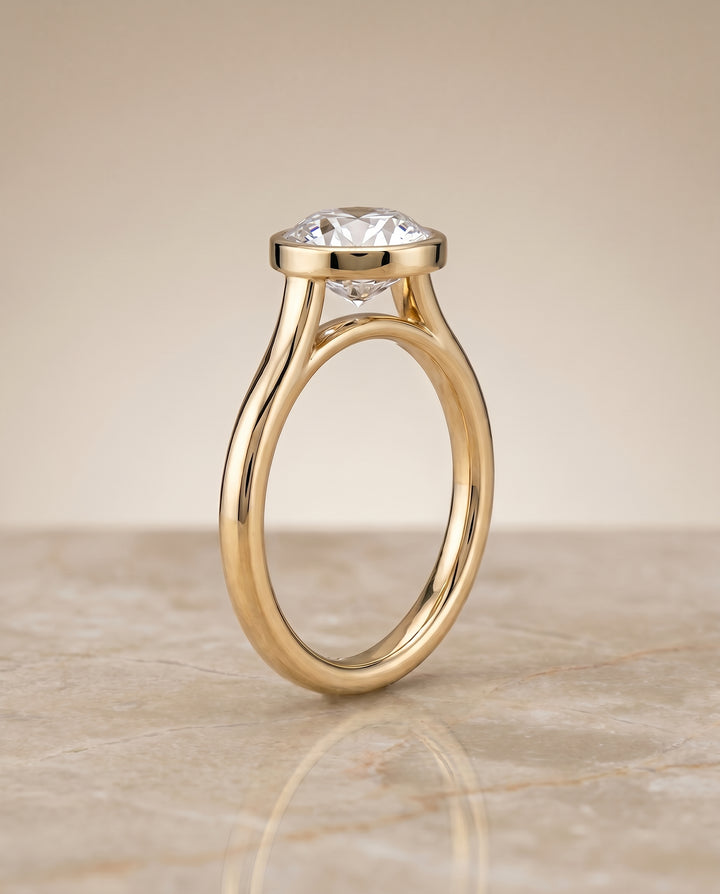 The Duran Bezel Solitaire Engagement Ring Setting for Round Diamonds in 18K Yellow Gold