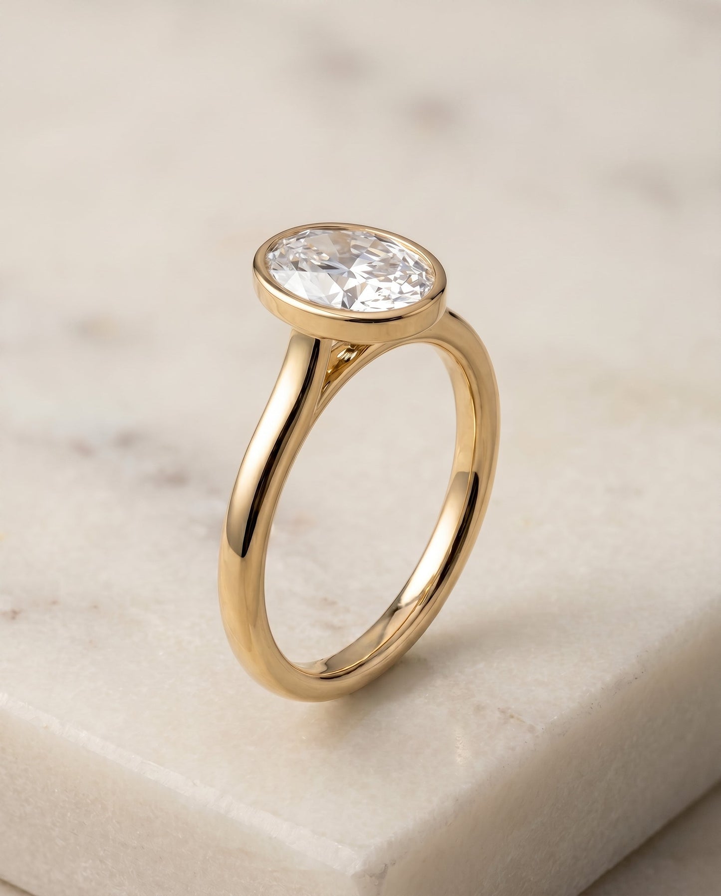 Duran Select Simple Bezel Solitaire Oval Lab Diamond Engagement Ring in 18K Yellow Gold, front view | RockHer