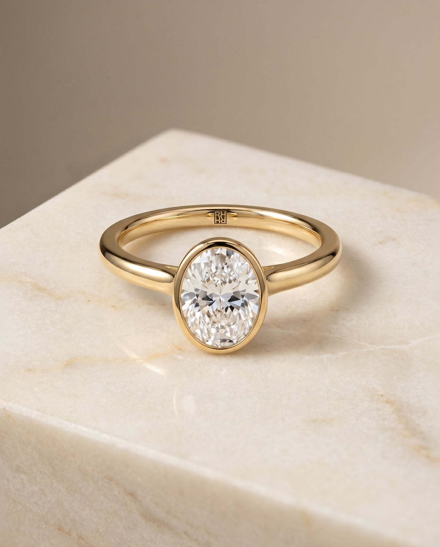 The Duran Bezel Solitaire Engagement Ring Setting for Oval Diamonds in 18K Yellow Gold | RockHer