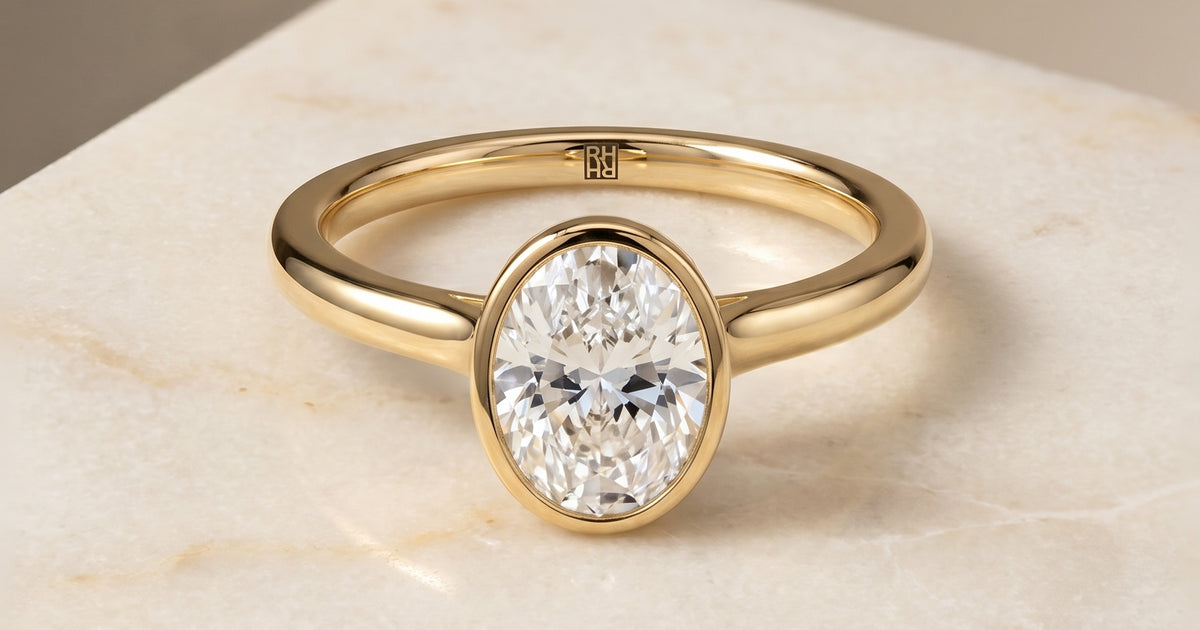 Duran Simple Bezel Solitaire Oval 18K Yellow Gold Engagement Ring
