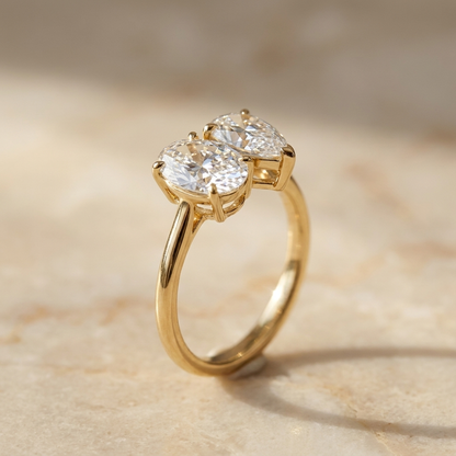 Solange Toi et Moi Oval & Pear Engagement Ring Setting - Alt angle on warm marble