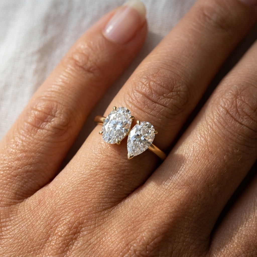 Solange Toi et Moi Oval & Pear Engagement Ring Setting - Macro close-up on finger
