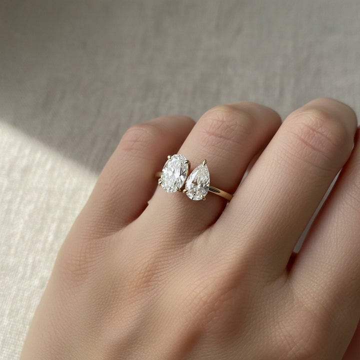 Solange Toi et Moi Oval & Pear engagement ring setting worn on hand
