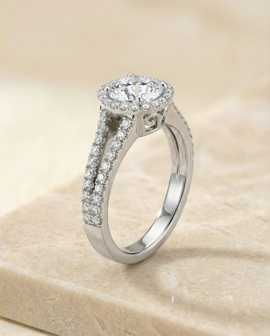 The Aretha Split Shank Pavé Halo Round in 18K White Gold