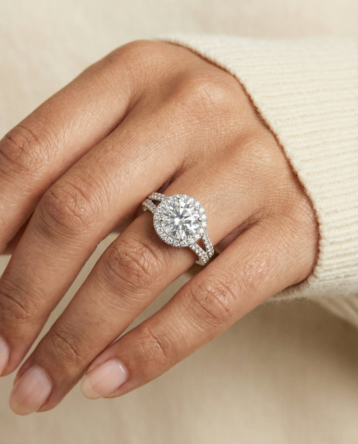 Aretha Select Pav Halo Split Shank Round Lab Diamond Engagement Ring in Platinum, shown on hand | RockHer