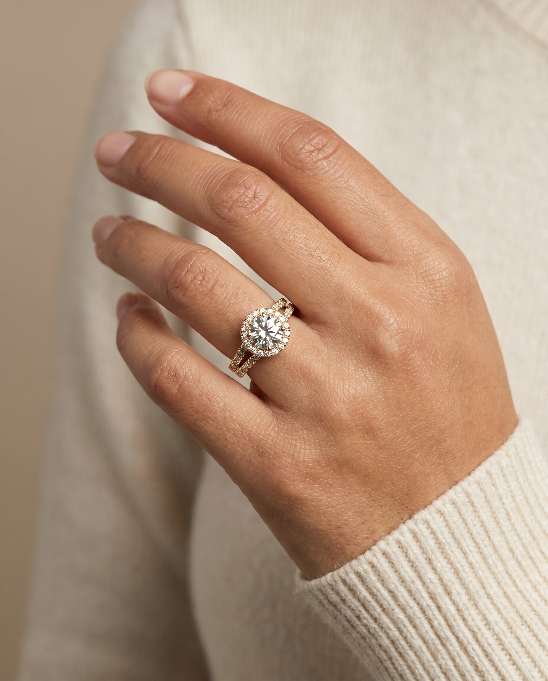 Nicki Select Split Shank Pavé Halo Round Lab Diamond Engagement Ring in 18K Yellow Gold, shown on hand | RockHer