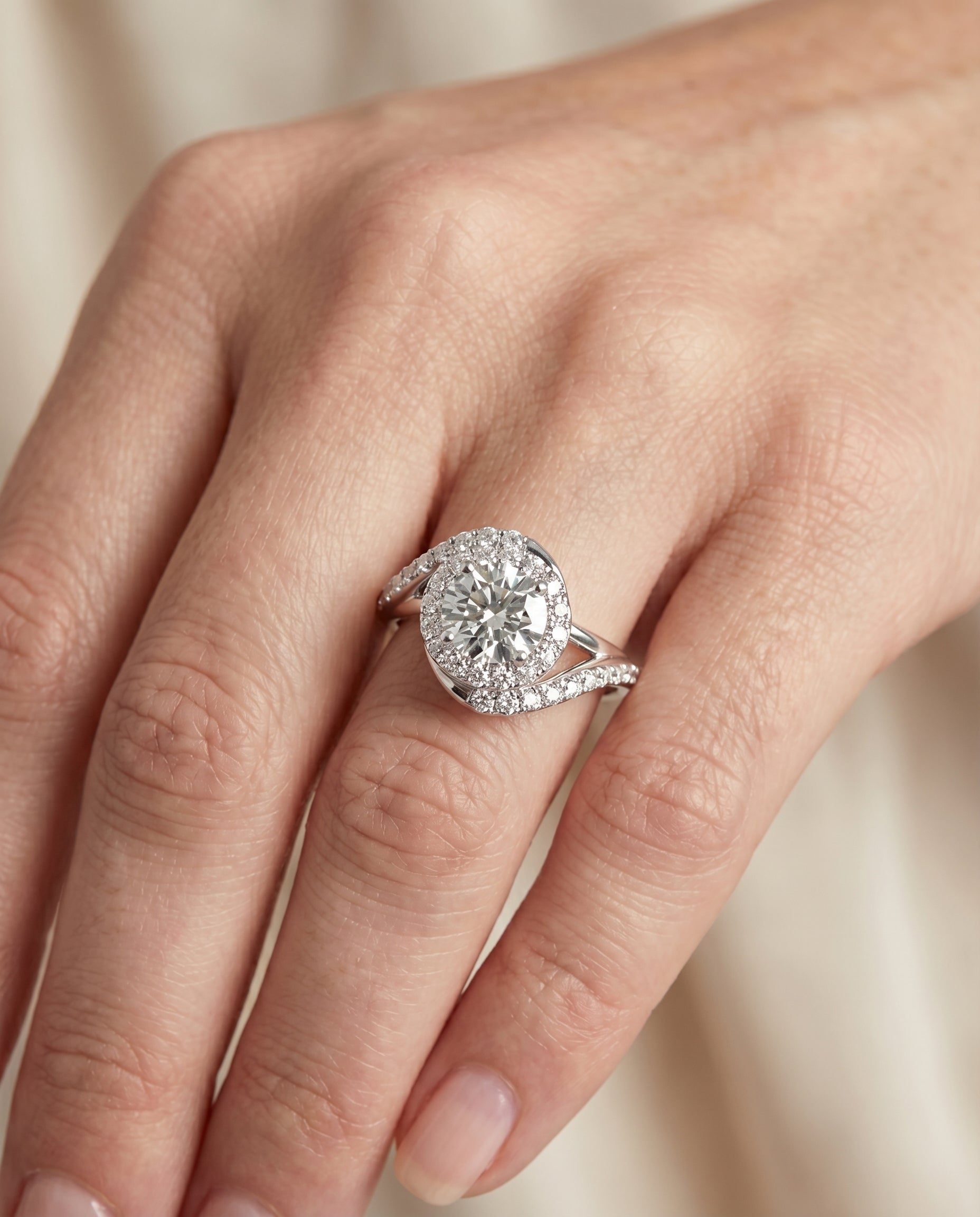 The Ariana engagement ring setting in Platinum, swirl halo design | RockHer
