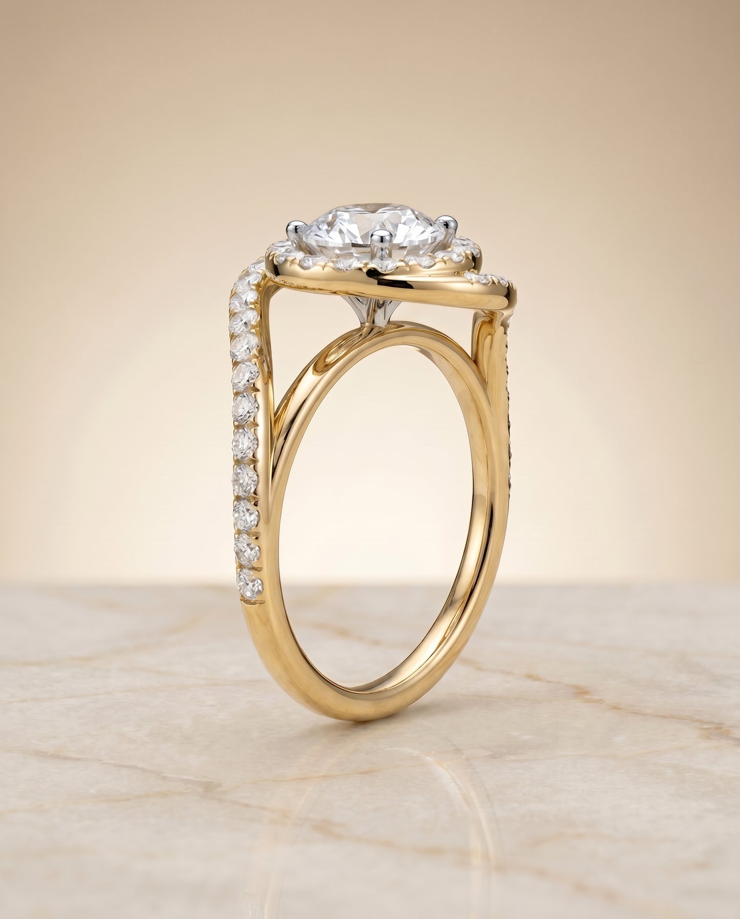Round Brilliant, Swirl Twist Pavé Halo, in 18K Yellow Gold, pave setting – angled view | RockHer