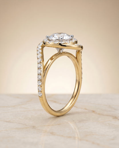 Round Brilliant, Swirl Twist Pavé Halo, in 18K Yellow Gold, pave setting – angled view | RockHer