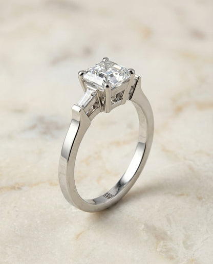 Tapered Baguette Three Stone Asscher, in Platinum, channel setting – front view | RockHer