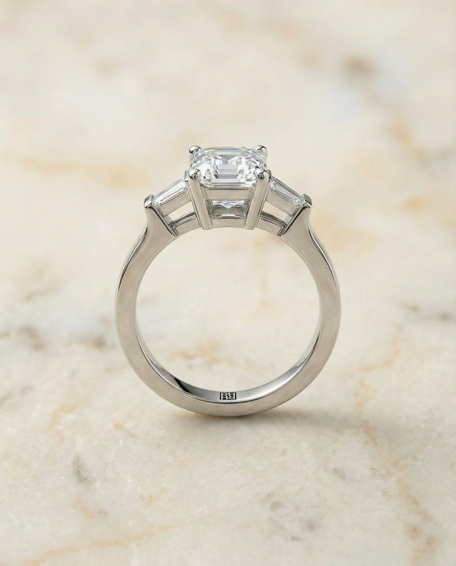 The June three stone cut engagement ring setting, shown in Platinum | RockHer