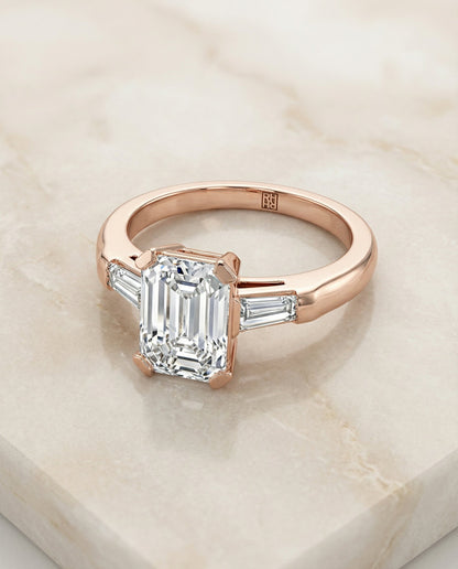 Caroline Select Three Stone Emerald Cut Lab Diamond Engagement Ring in 14K Rose Gold, alternate angle | RockHer