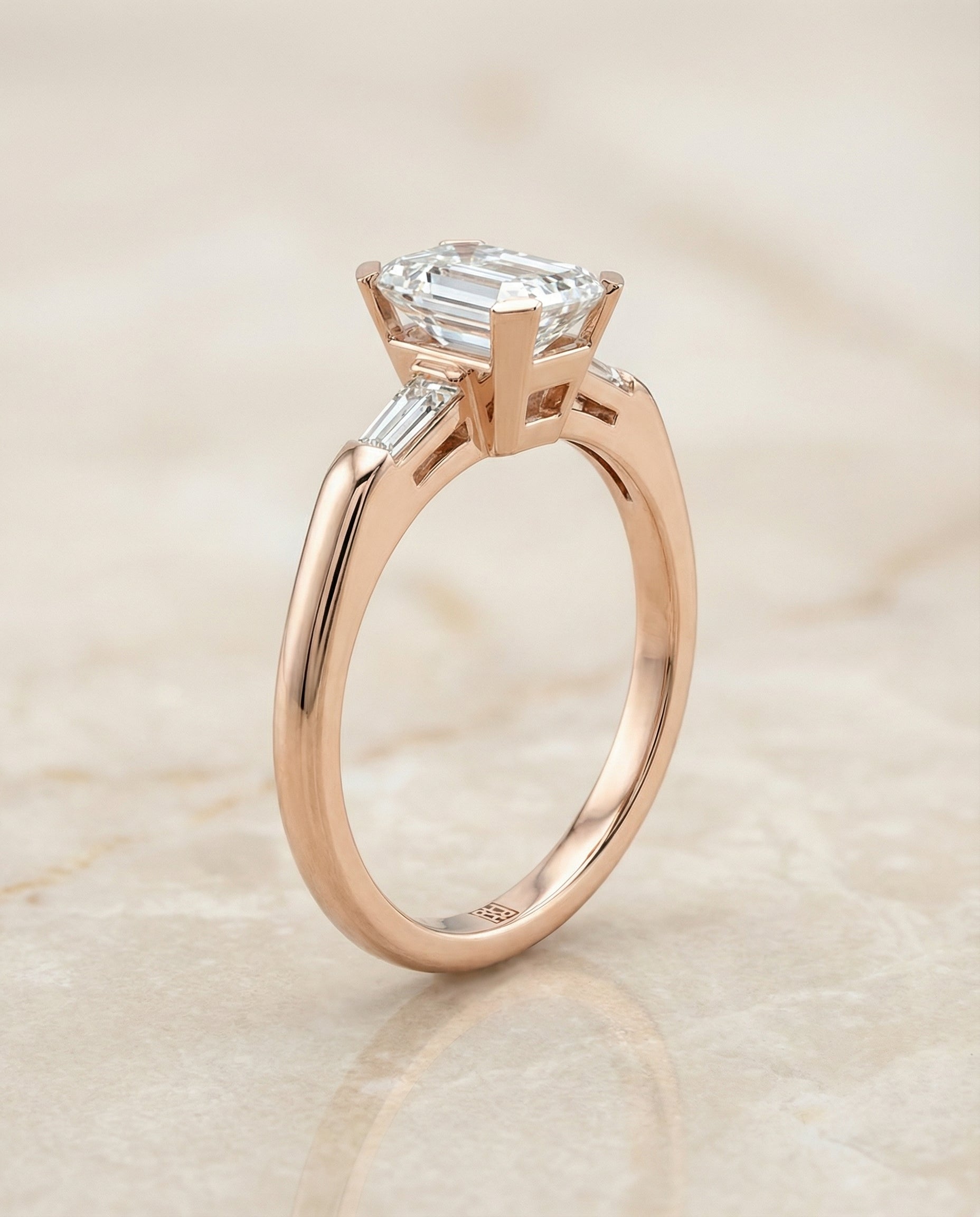The Caroline three stone cut engagement ring setting, shown in 14K Rose Gold | RockHer