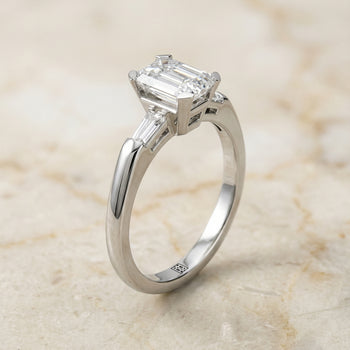The Caroline Three Stone Emerald Cut Engagement Ring Setting in Platinum