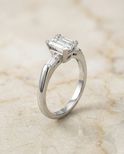 European Cut, Tapered Baguette Three Stone Emerald, in Platinum – front view | RockHer