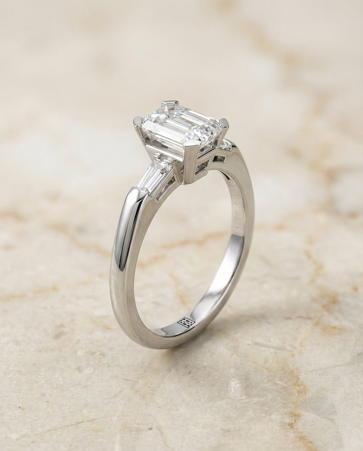 European Cut, Tapered Baguette Three Stone Emerald, in Platinum – front view | RockHer