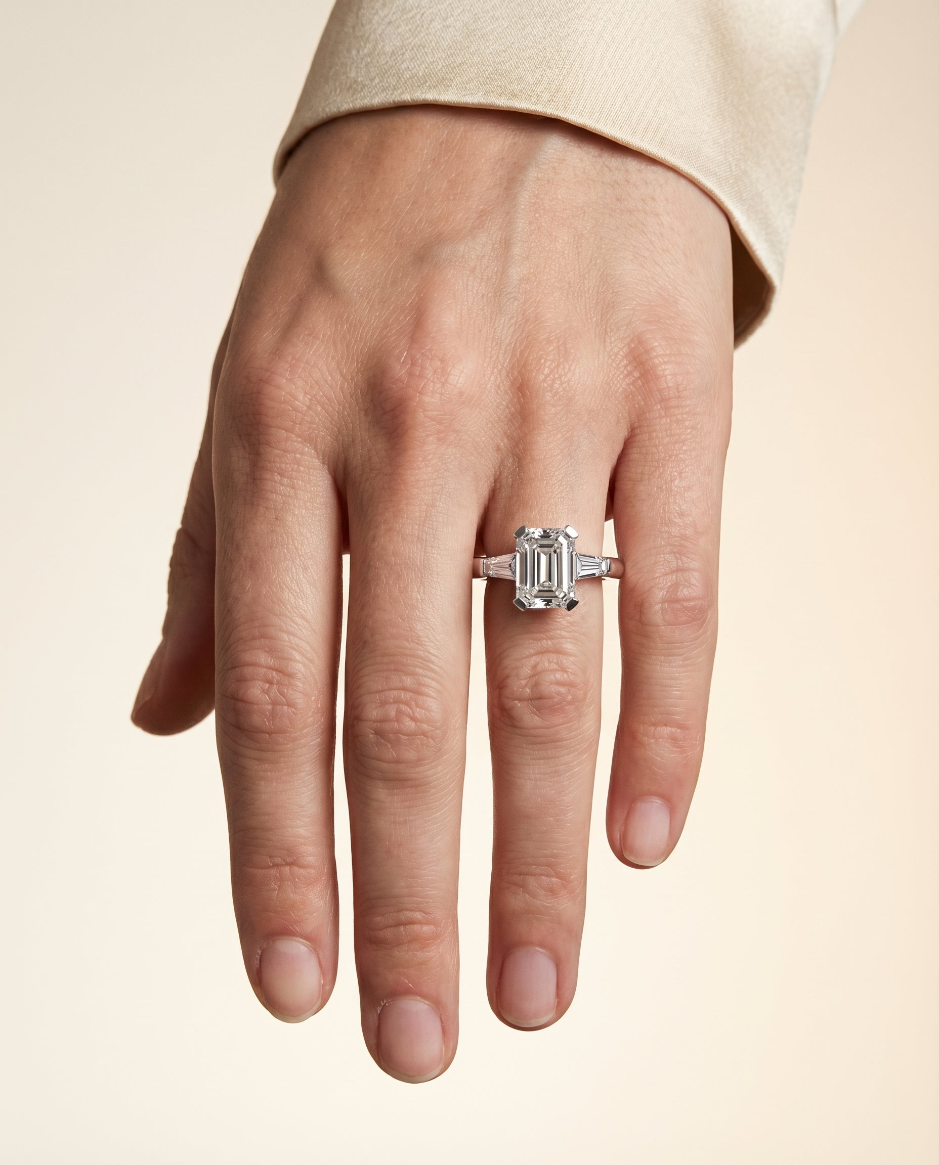 Caroline Select Three Stone Emerald Cut Lab Diamond Engagement Ring in Platinum, shown on hand | RockHer
