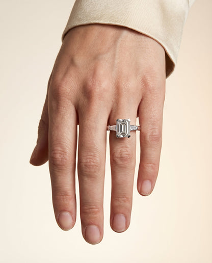 Caroline Select Three Stone Emerald Cut Lab Diamond Engagement Ring in 18K White Gold, shown on hand | RockHer