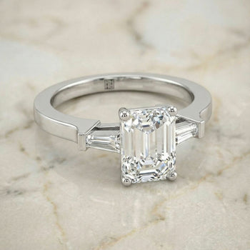 The June Three Stone Emerald Cut Engagement Ring Setting in 18K White Gold