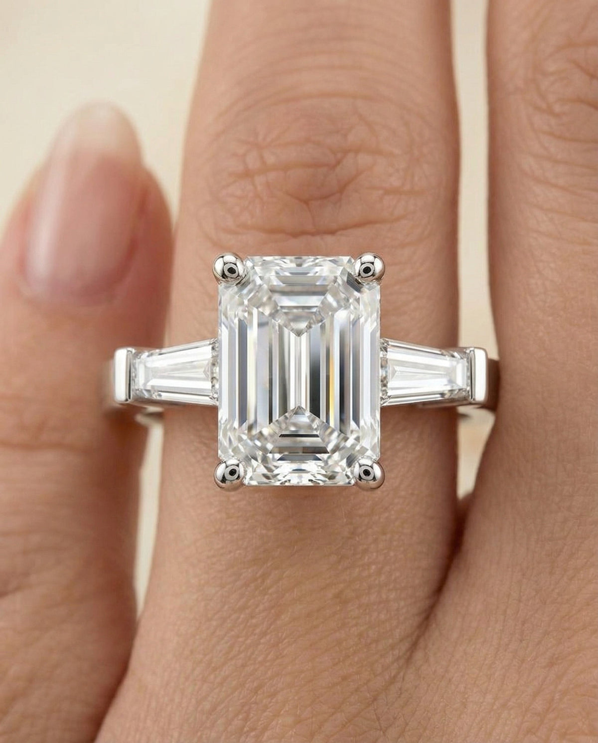 June Select Three Stone Emerald Cut Lab Diamond Engagement Ring in 18K White Gold, shown on hand | RockHer