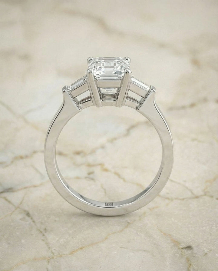 European Cut, Tapered Baguette Three Stone Emerald, in Platinum, channel setting – side profile | RockHer