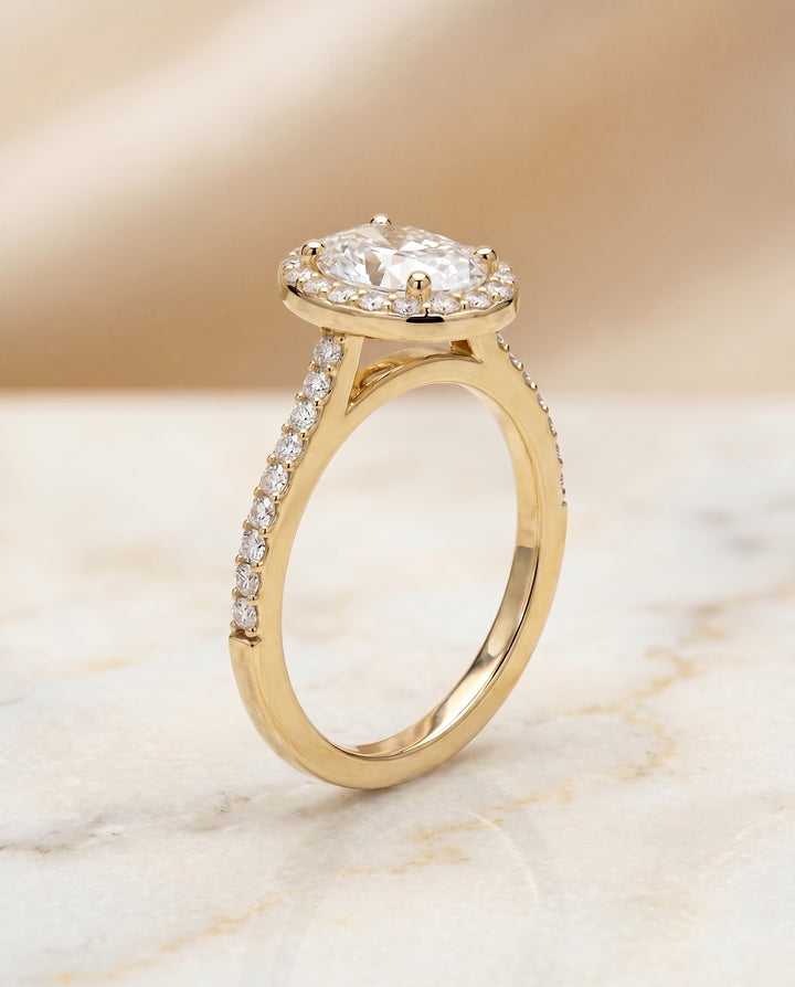 The Taylor Pavé Halo Engagement Ring Setting for Oval Diamonds in 18K Yellow Gold