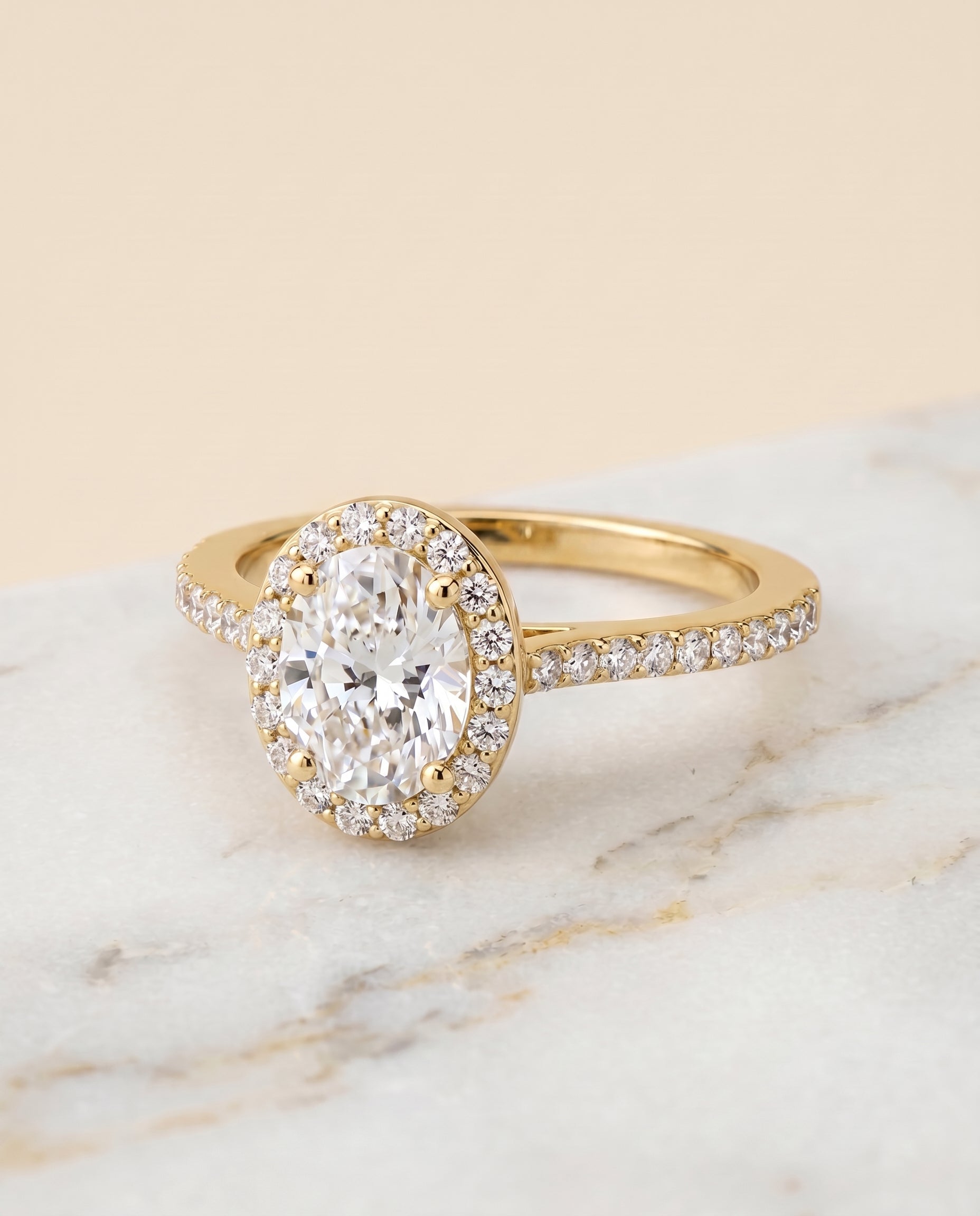The Taylor Pavé Halo Engagement Ring Setting for Oval Diamonds in 18K Yellow Gold | RockHer