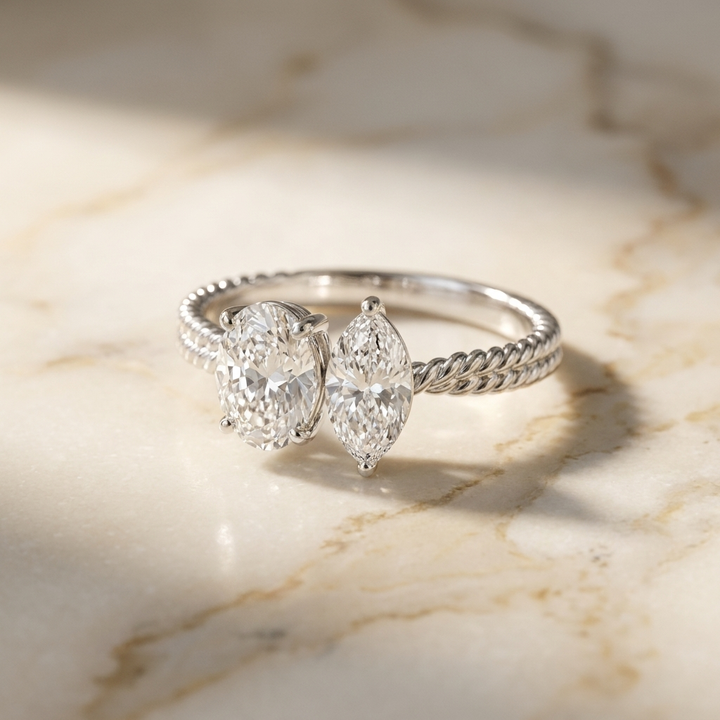 14K White Gold Taylor Select Toi et Moi Oval & Marquise Twisted Band Lab Diamond Engagement Ring - Hero on warm marble