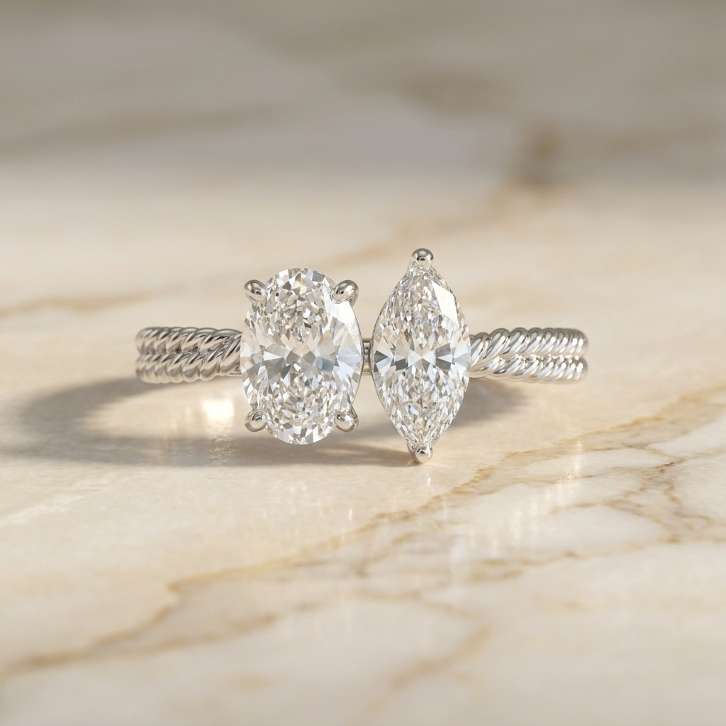 18K White Gold Taylor Select Toi et Moi Oval & Marquise Twisted Band Lab Diamond Engagement Ring - Hero on warm marble