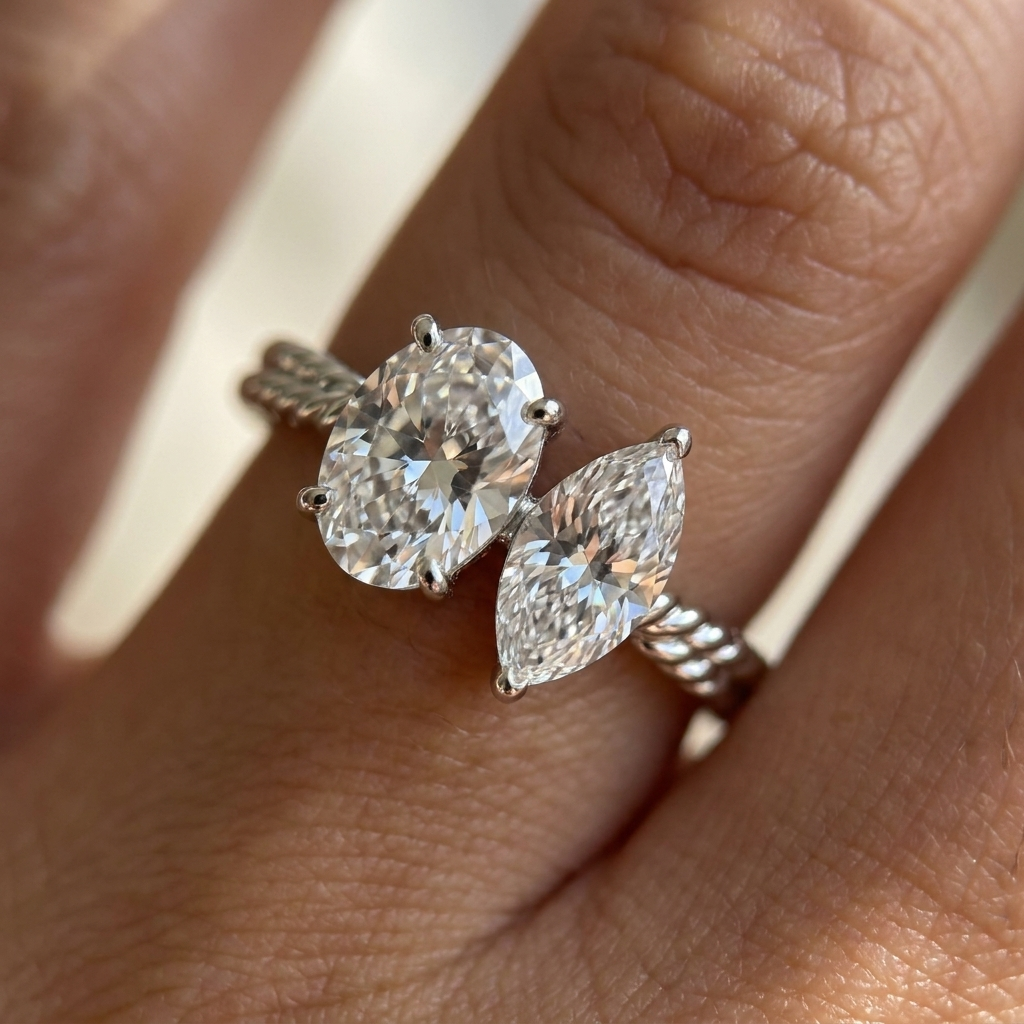 18K White Gold Taylor Select Toi et Moi Oval & Marquise Twisted Band Lab Diamond Engagement Ring - Macro close-up on finger