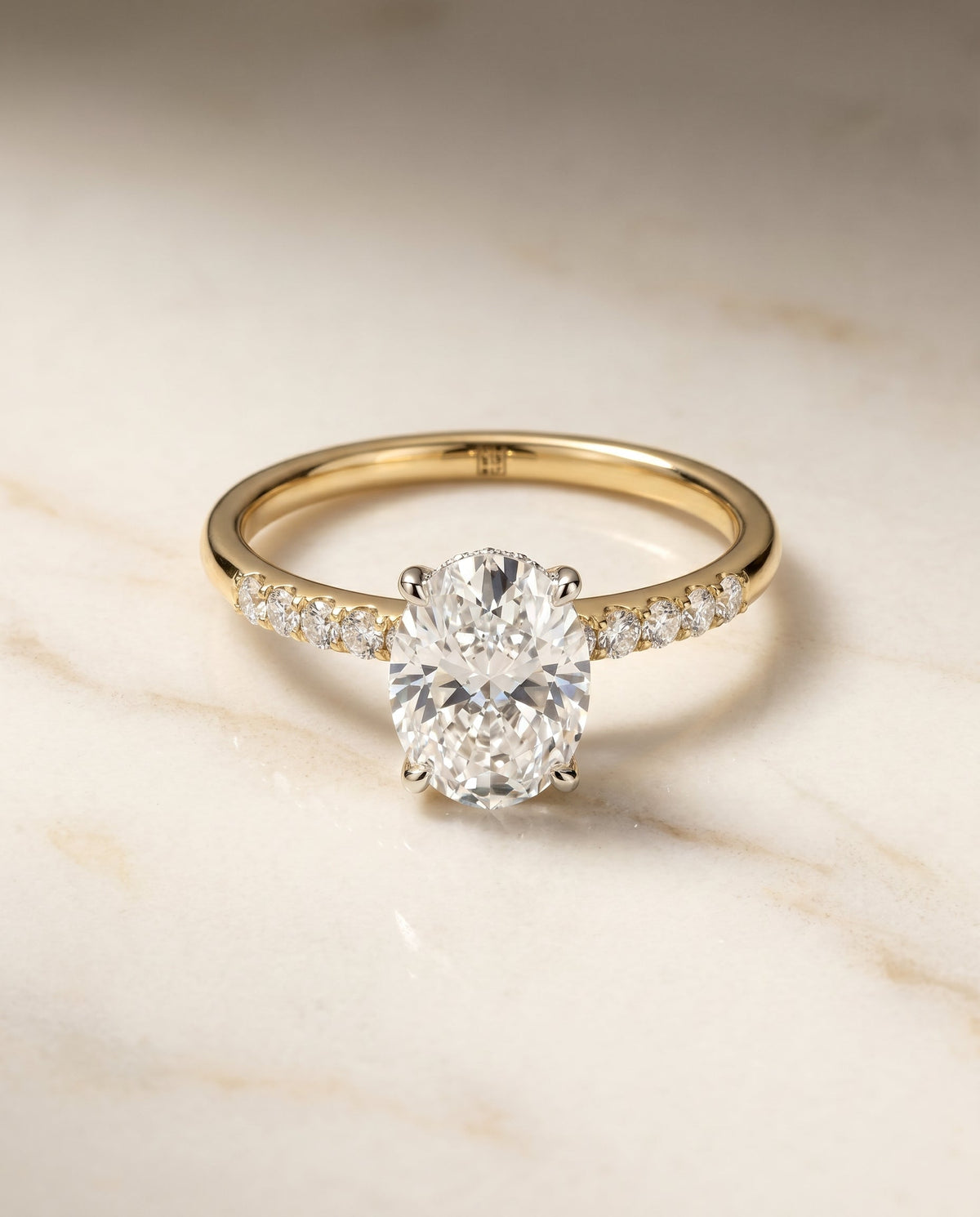 Abbey Select Hidden Halo Pavé Oval Lab Diamond Engagement Ring in 18K Yellow Gold, shown on hand, angled | RockHer