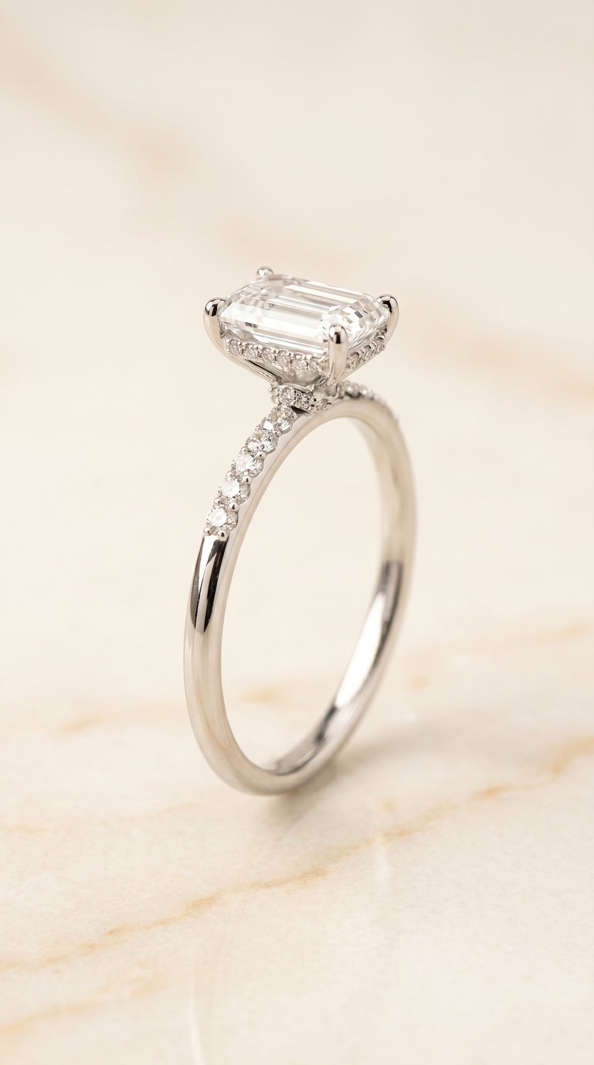 Select Hidden Halo Pavé Cut styling on The Abbey emerald engagement ring setting | RockHer