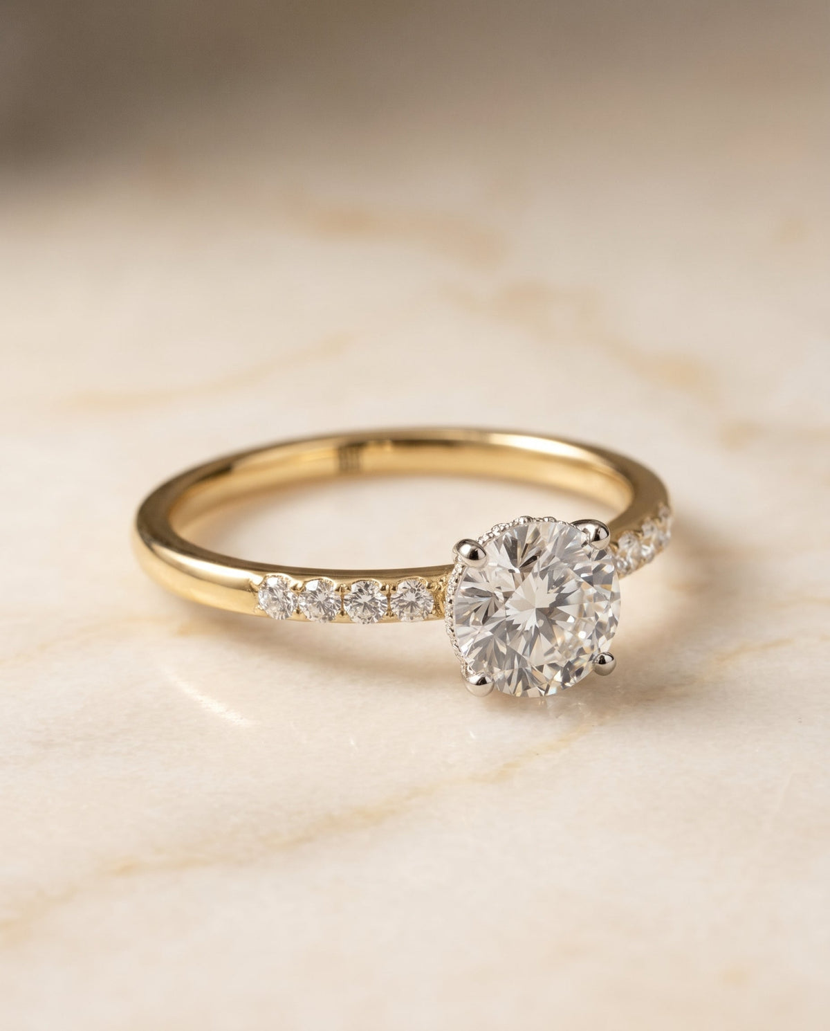 Abbey Select Hidden Halo Pavé Round Lab Diamond Engagement Ring in 18K Yellow Gold, shown on hand, angled | RockHer