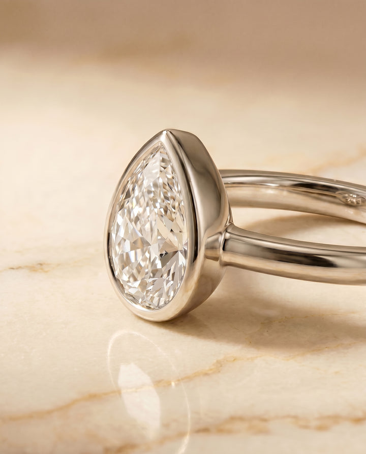 The Agnes Bezel Solitaire In Briolette Engagement Ring Setting in Platinum