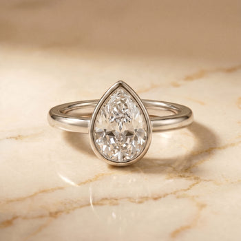 The Agnes Bezel Solitaire In Briolette Engagement Ring Setting in Platinum