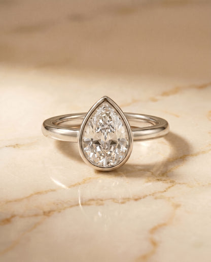The Agnes Bezel Solitaire In Briolette Engagement Ring Setting in Platinum