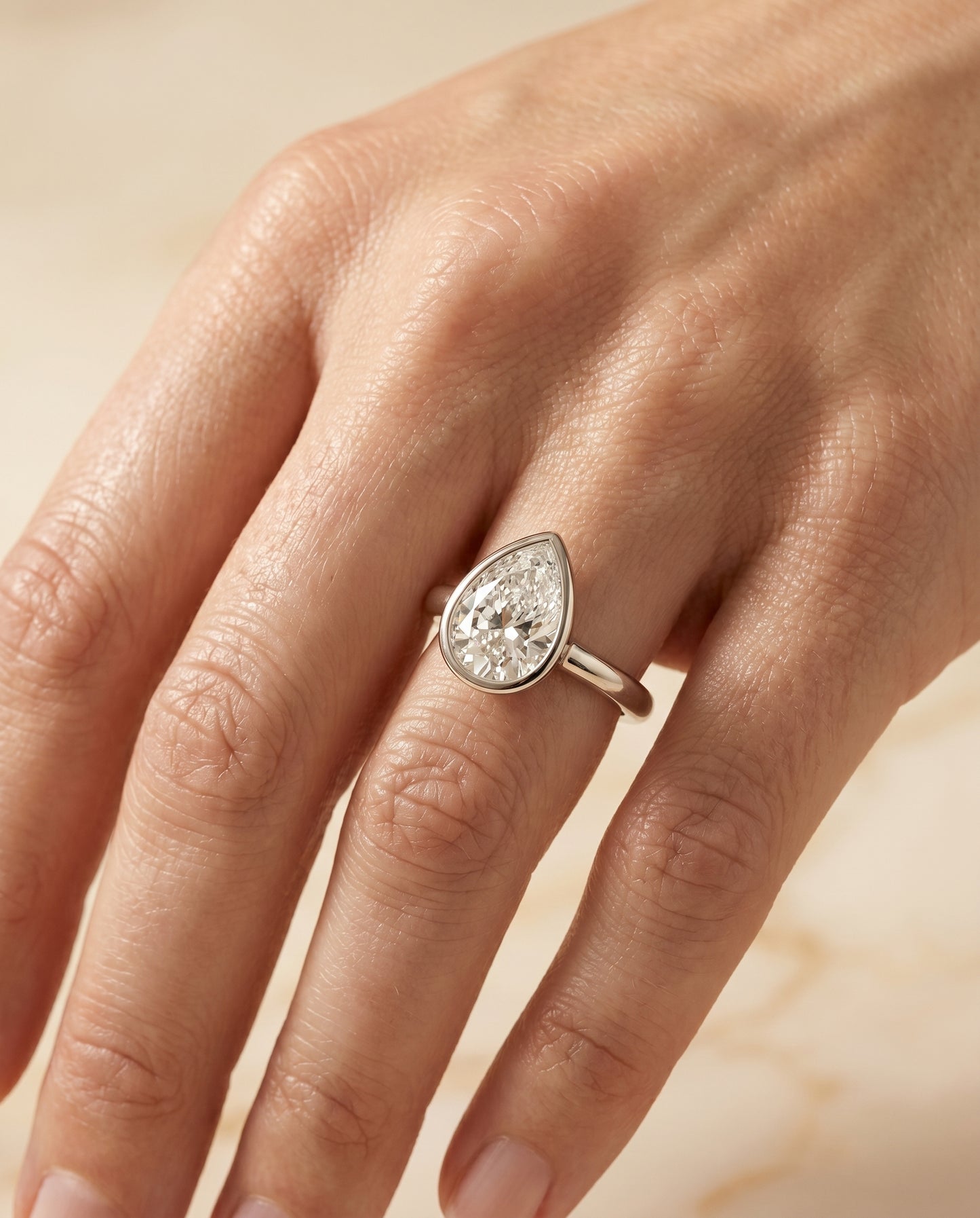 The Agnes Bezel Solitaire In Briolette Engagement Ring Setting in 18K White Gold