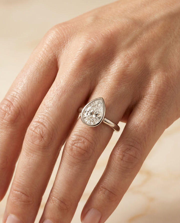 The Agnes Bezel Solitaire In Briolette Engagement Ring Setting in 18K White Gold