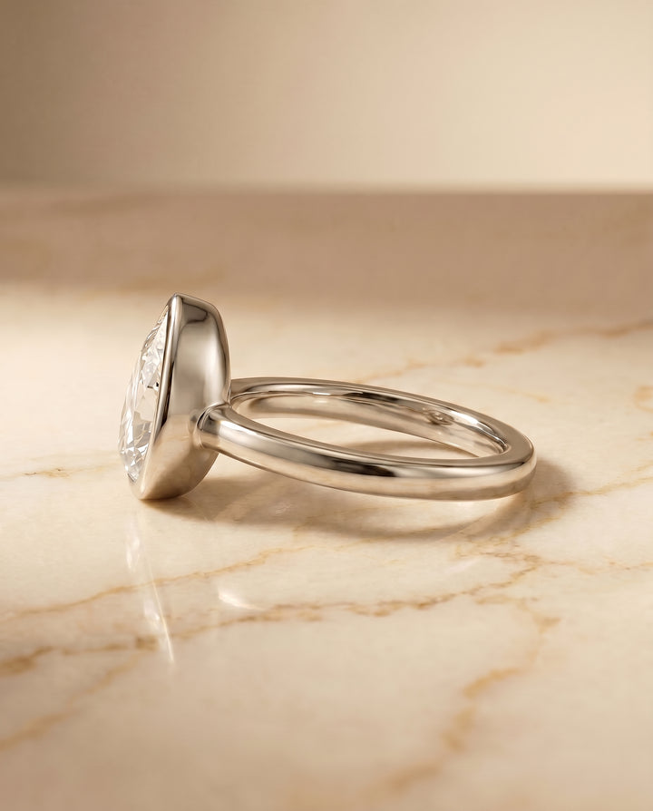 The Agnes Bezel Solitaire In Briolette Engagement Ring Setting in Platinum